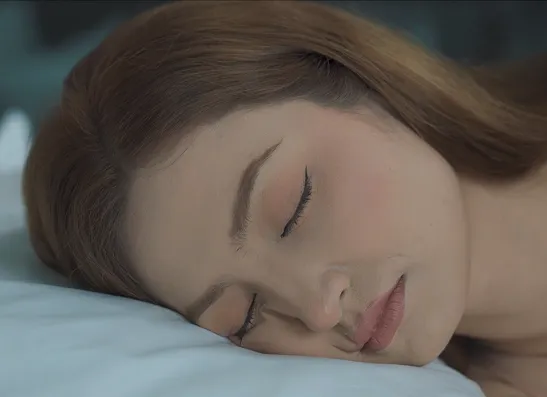 Woman sleeping peacefully on a pillow
